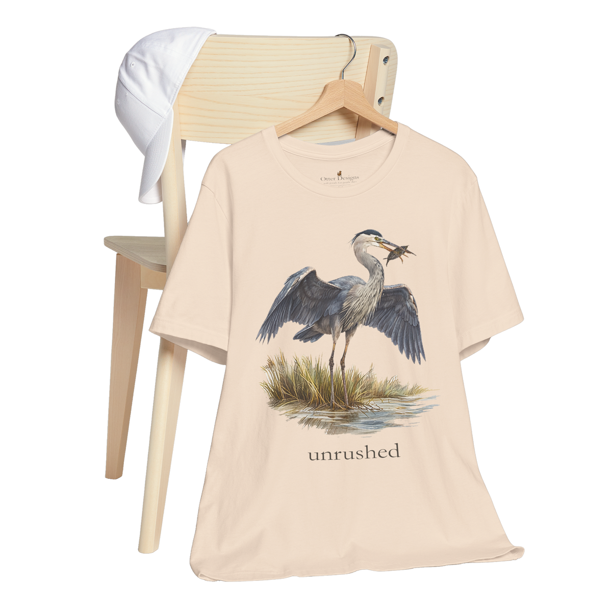 Great blue heron standing in shallow water with wings open on the Val T-shirt