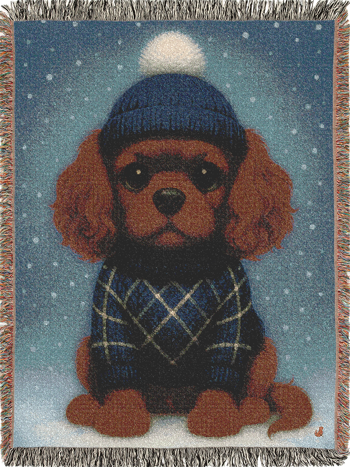 Cavy Comfort woven throw blanket, front view with fringed edges, Ruby Cavalier King Charles Spaniel puppy in a knit beanie and sweater in the snow